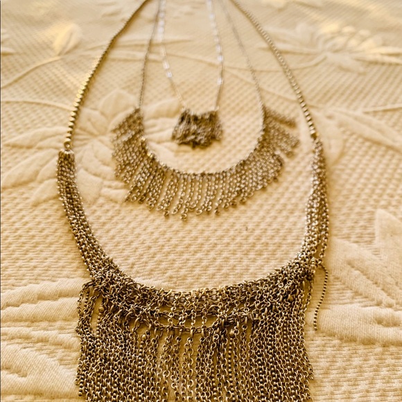 Layered silver chain necklace. Wears long.